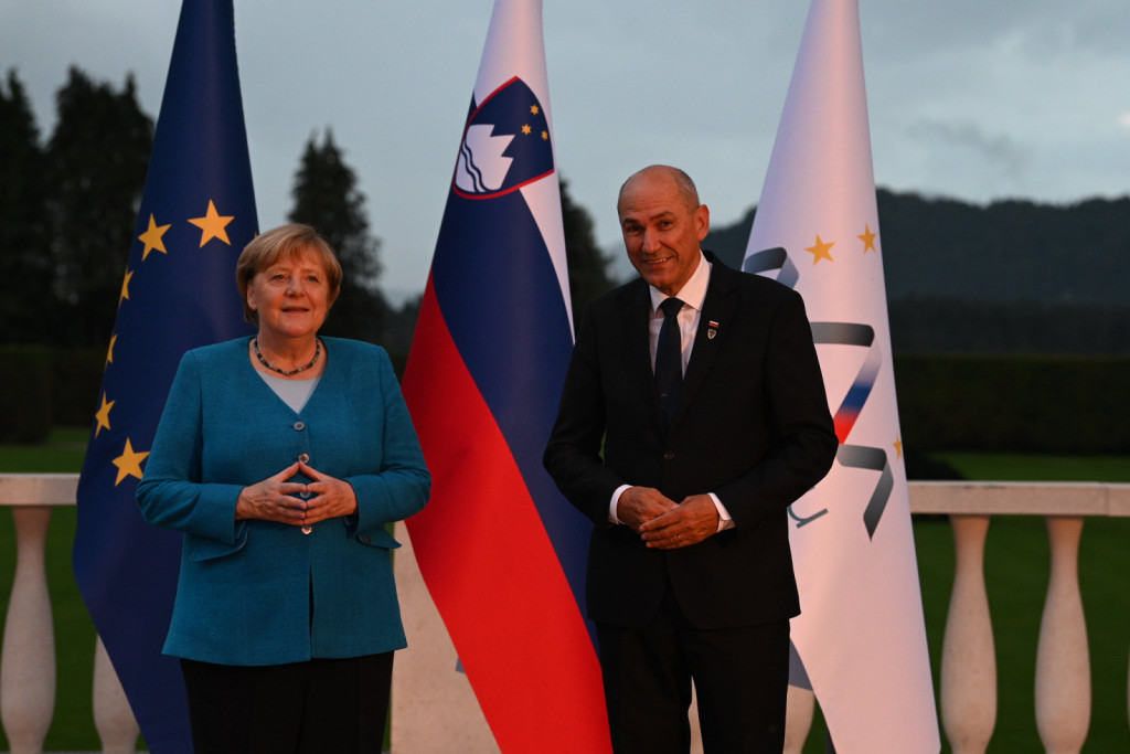 				Jan&scaron;a in Angela Merkel			